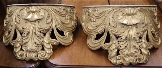 A pair of large gilt carved wall brackets W.59cm